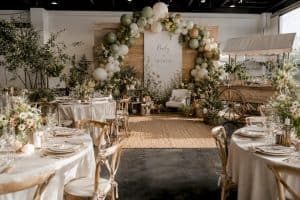 Event designer building balloon arch frame indoors