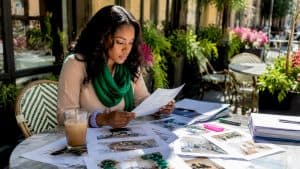 Event planner reviewing decor vendor proposals at table