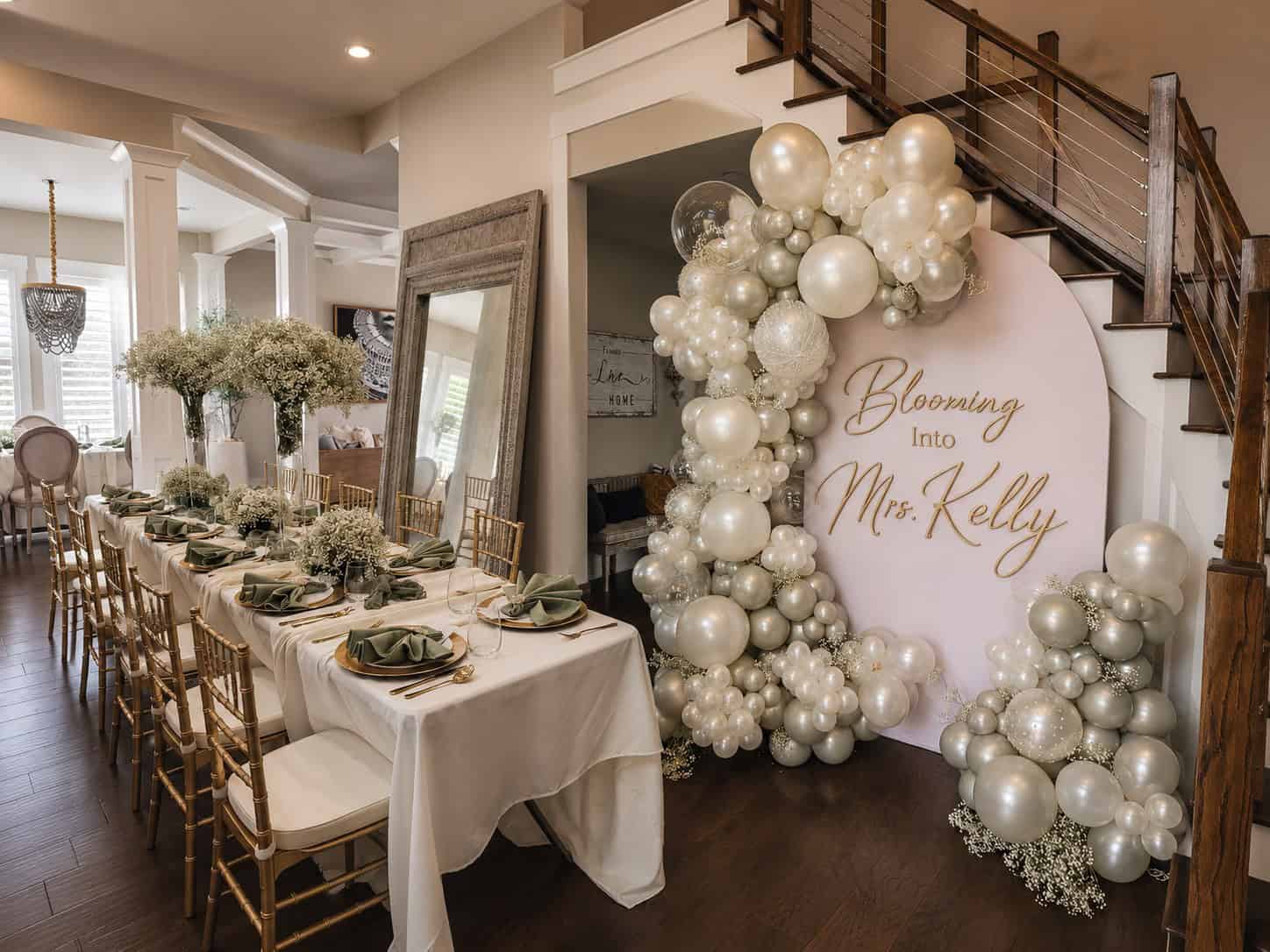 Balloon Decor Pricing 69 Luxury bridal shower featuring a custom pearl white, silver, and champagne organic balloon garland surrounding a personalized round backdrop with elegant tablescapes and floral décor. Atlanta Balloon Designer created this sophisticated event design using premium balloon decorations, custom backdrops, event rentals, organic balloon arches, specialty balloons, luxury event décor, and professional installation for bridal showers, weddings, engagement parties, and upscale celebrations throughout Metro Atlanta.