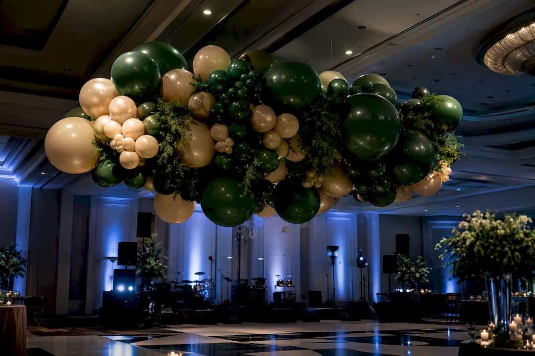 Ceiling Decor Ideas That Transform Any Event Space Sculptural balloon pendant over dance floor