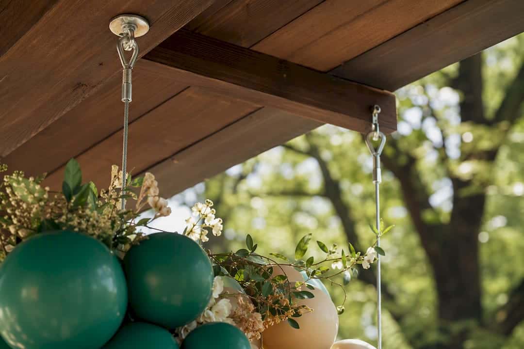 Ceiling Decor Ideas That Transform Any Event Space Close-up of rigging hardware with balloon decor