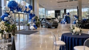 Cobalt and chrome arch inside dealership showroom