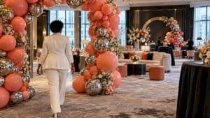 Atlanta VIP lounge with coral balloon arch